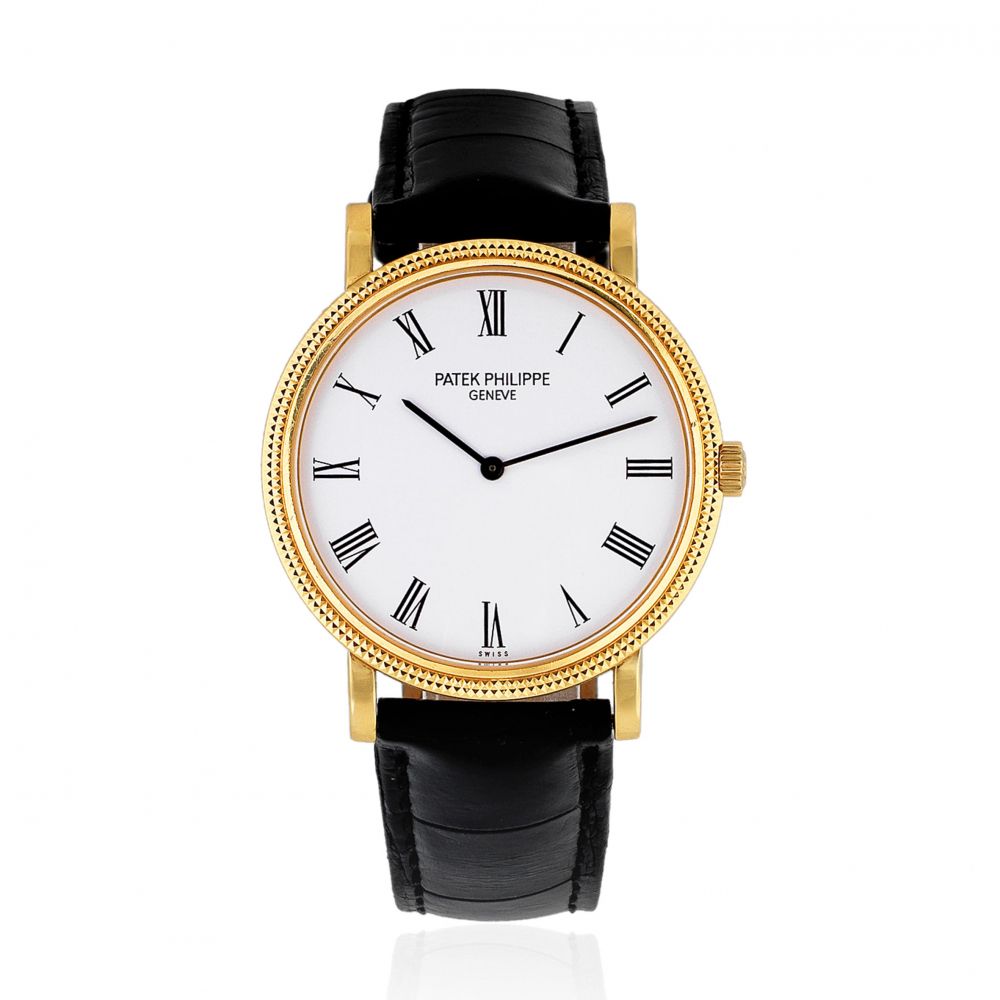 Patek Philippe. An 18K gold automatic wristwatch with hobnail bezel