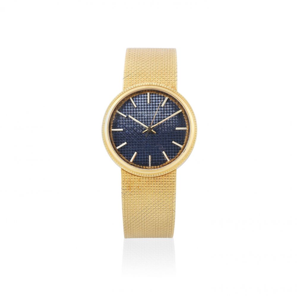 Patek Philippe. An 18K gold automatic bracelet watch