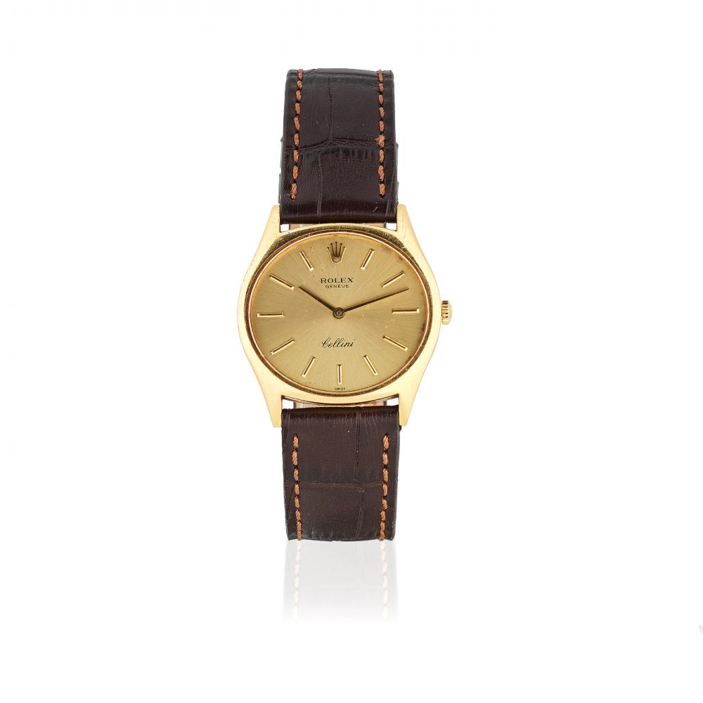 Rolex. An 18K gold manual wind wristwatch