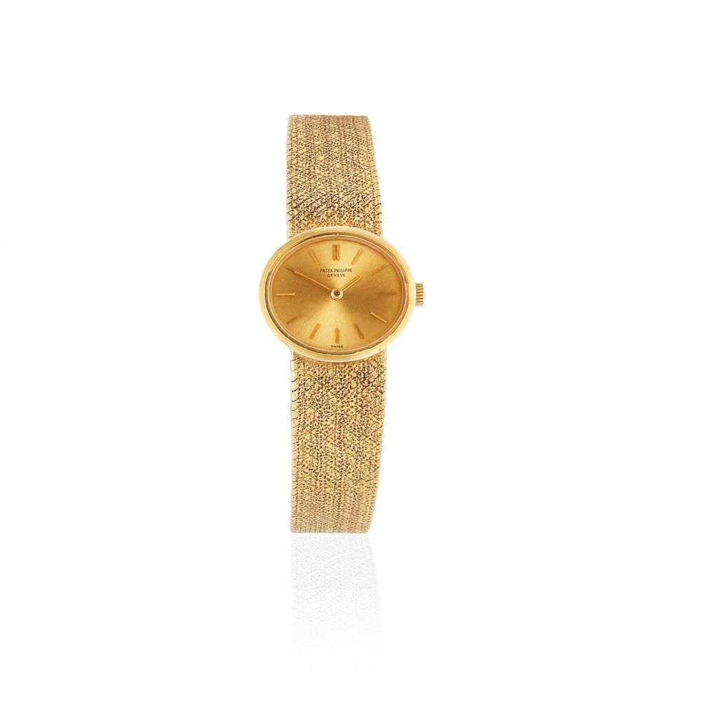 Patek Philippe. A lady's 18K gold manual wind bracelet watch