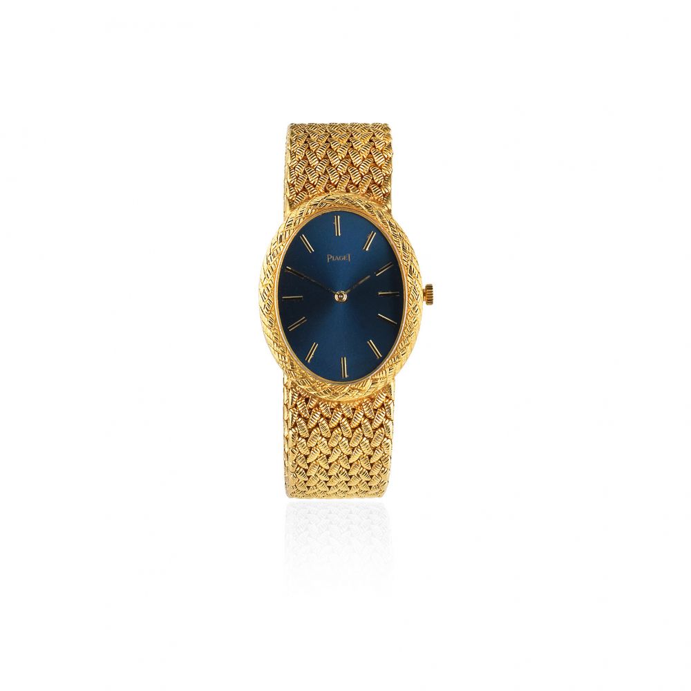 Piaget. A lady's 18K gold manual wind oval bracelet watch