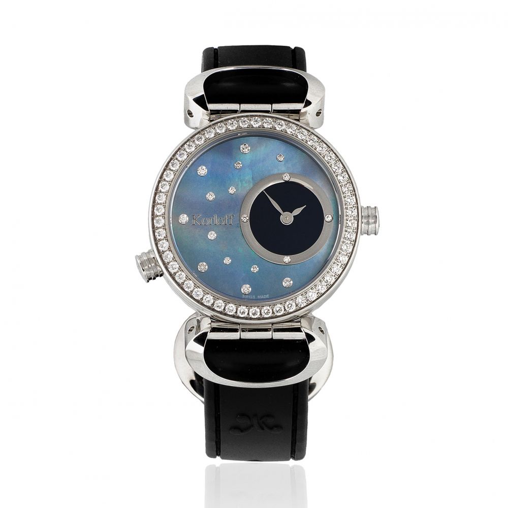 Korloff. A lady's stainless steel and diamond set quartz reversible wristwatch with dual mother of pearl dials