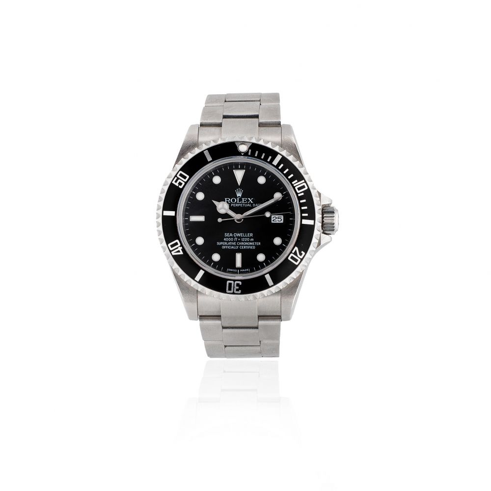 Rolex. A stainless steel automatic calendar bracelet watch