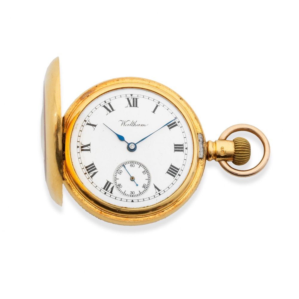 Waltham. An 18K gold keyless wind half hunter pocket watch
