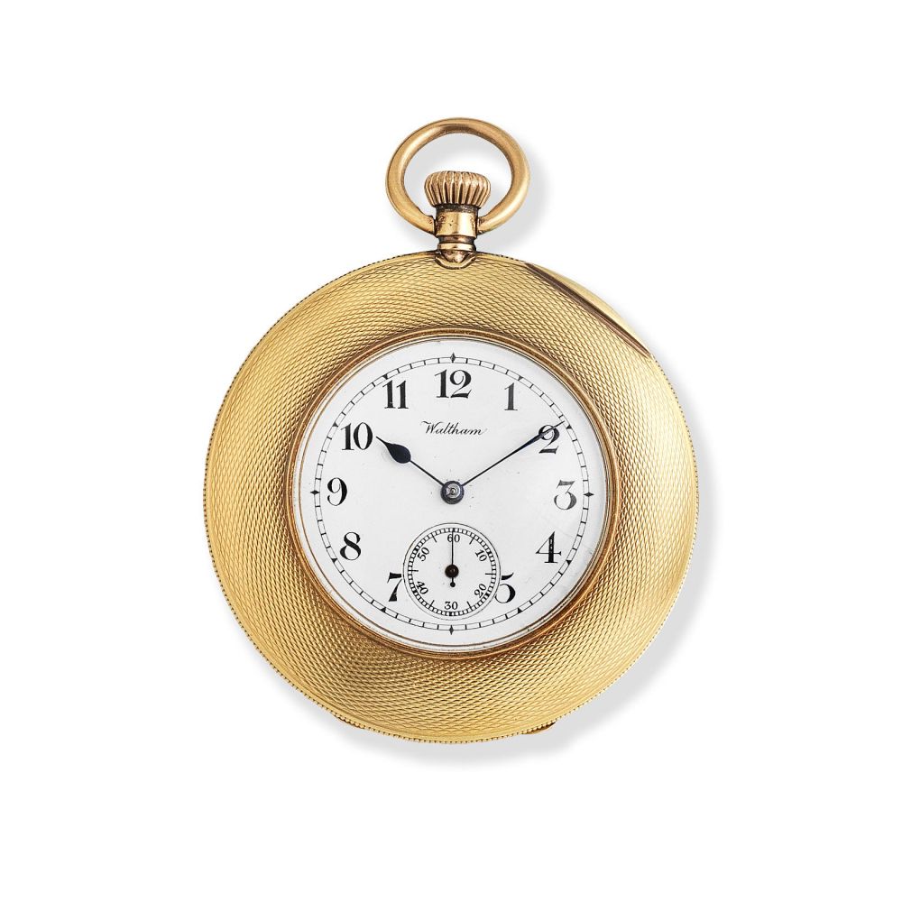 Waltham. An 18K gold keyless wind open face pocket watch