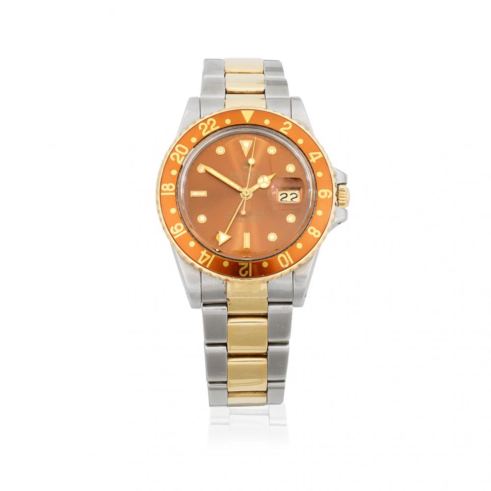 Rolex. A stainless steel and gold automatic calendar bracelet watch with dual time zone