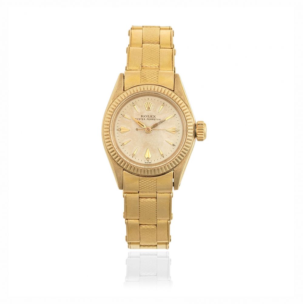 Rolex. A lady's 9K gold automatic bracelet watch
