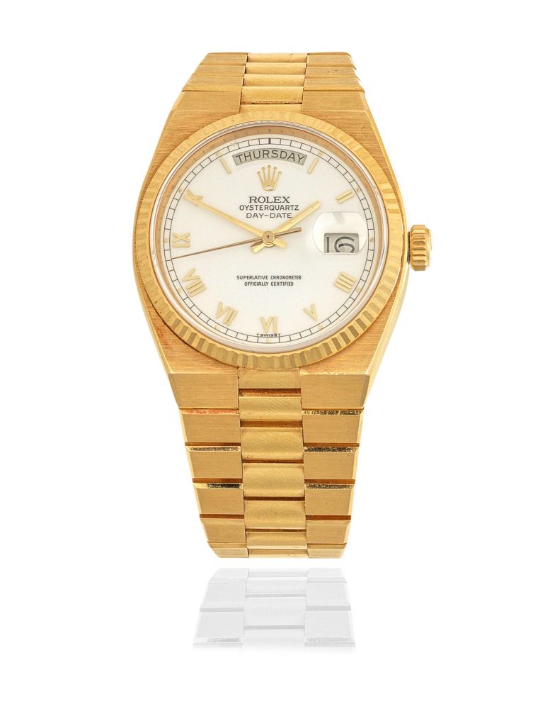 Rolex. An 18K gold quartz calendar bracelet watch