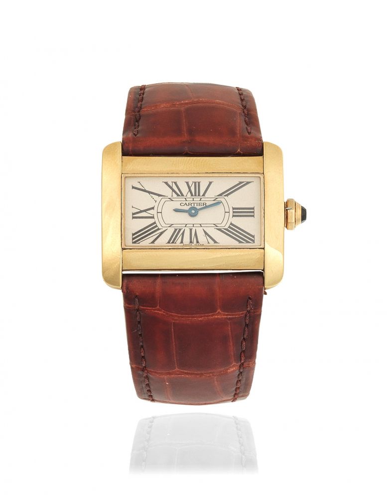 Cartier. A lady's 18K gold quartz rectangular wristwatch