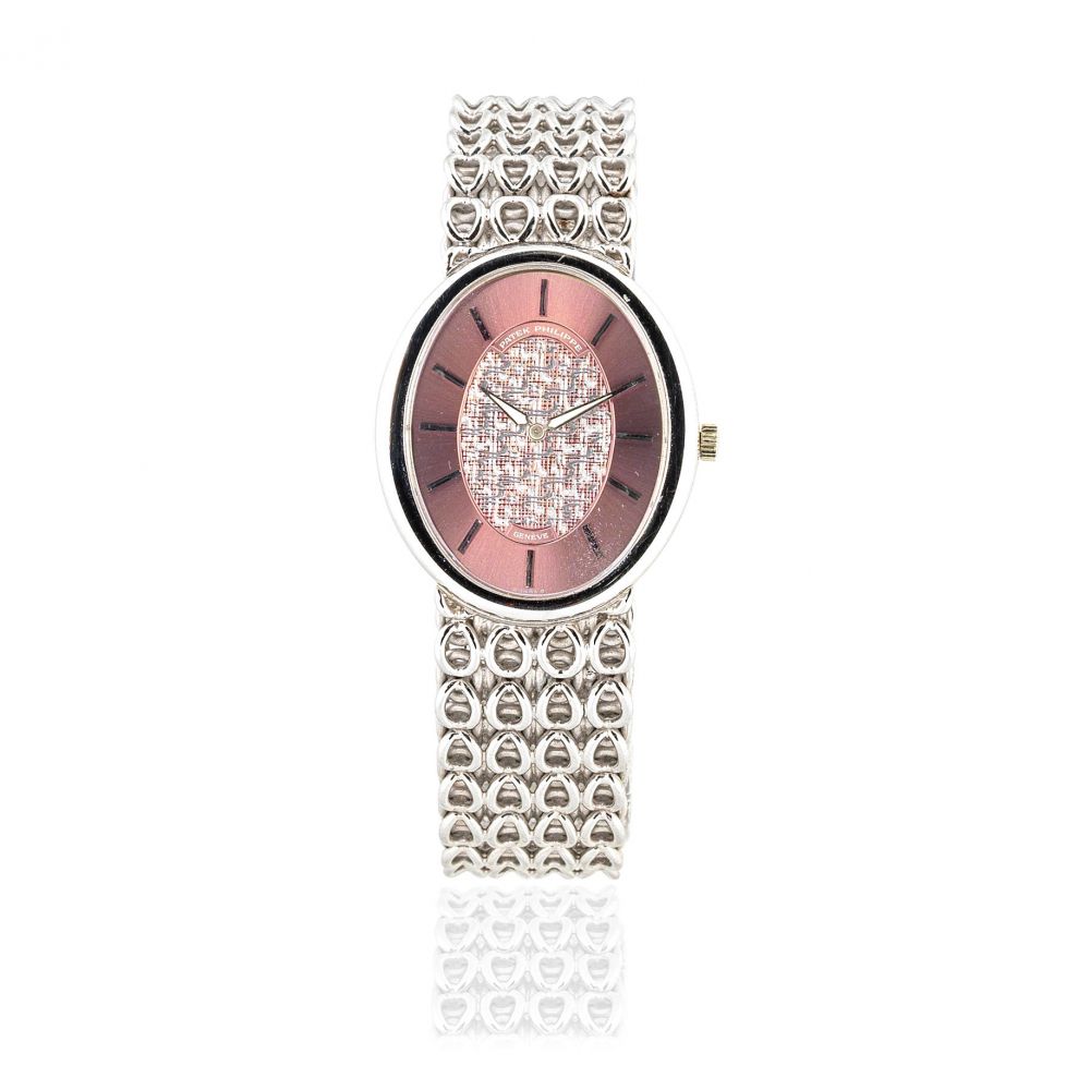 Patek Philippe. An 18K white gold manual wind bracelet watch with sigma dial