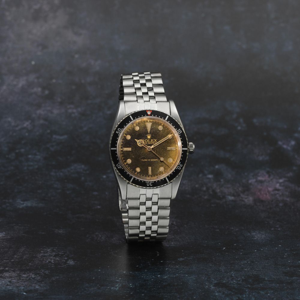 Rolex. A fine and rare stainless steel automatic bracelet watch with gilt dial
