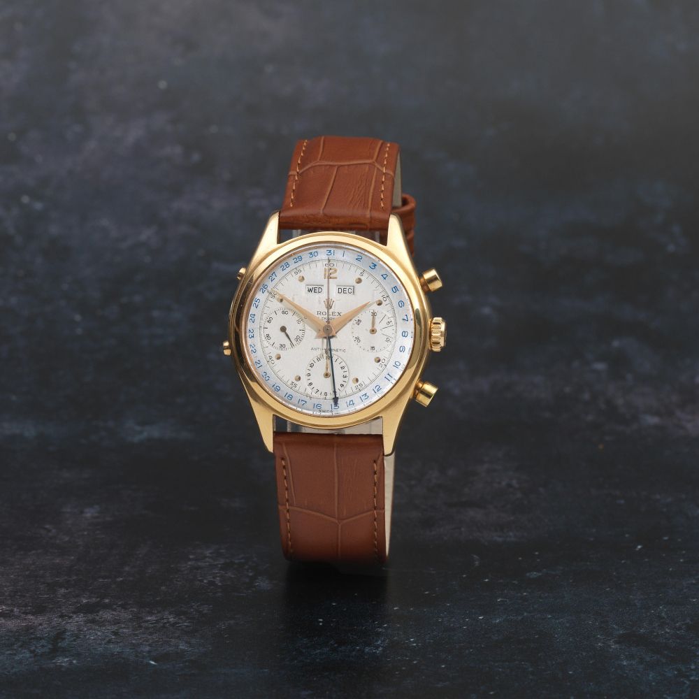 Rolex. A fine and rare 18K gold manual wind triple calendar chronograph wristwatch
