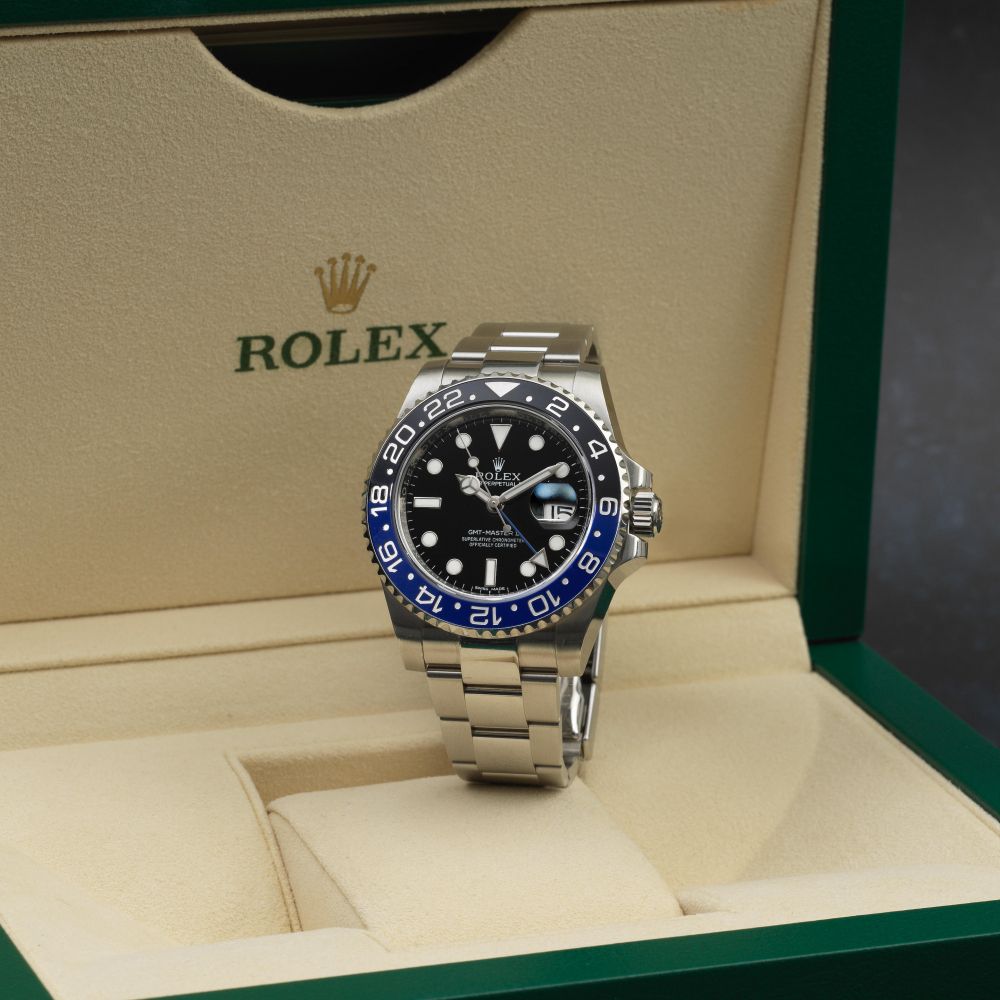 Rolex. A stainless steel automatic calendar bracelet watch with dual time zone