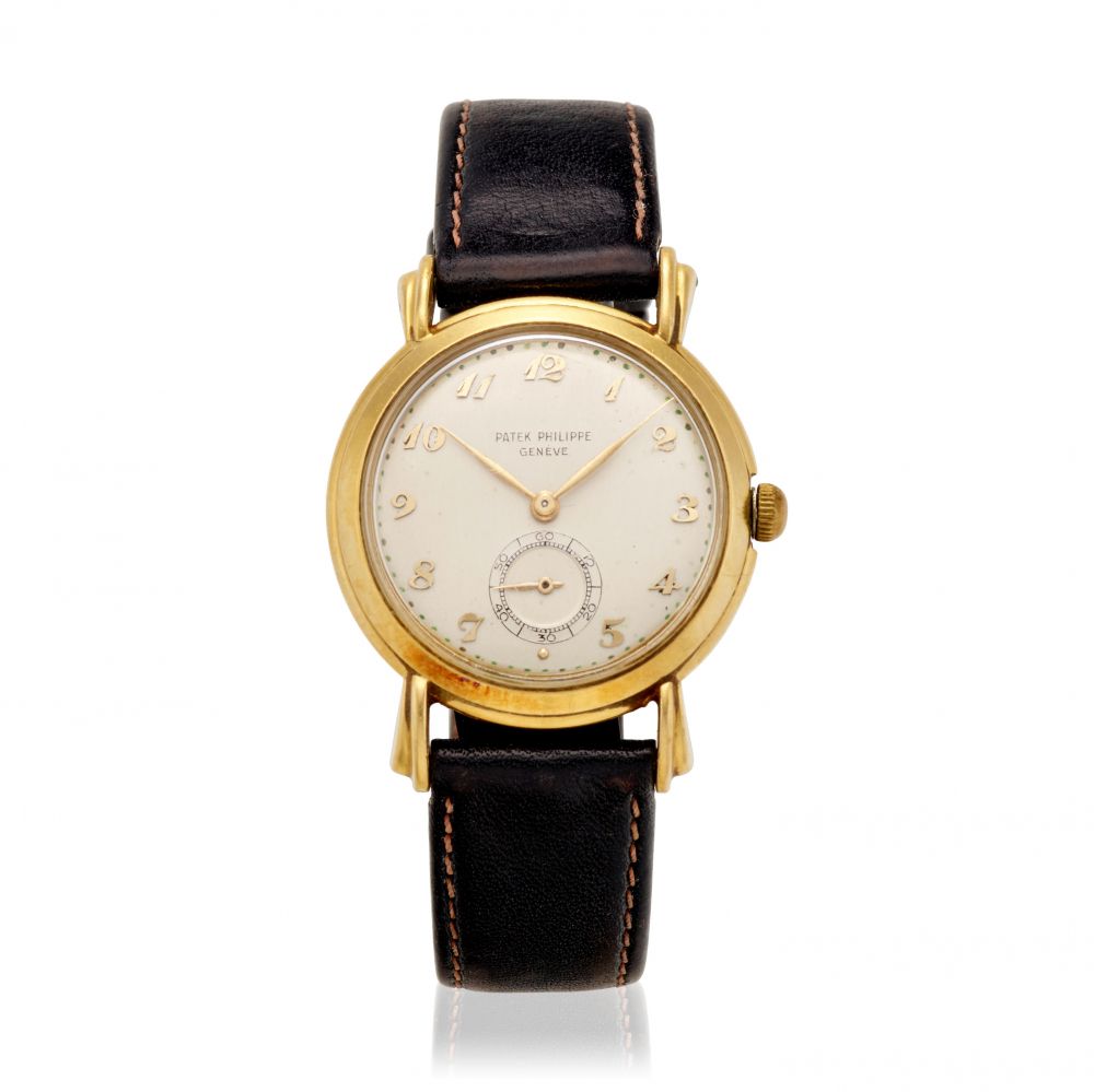 PATEK PHILIPPE. AN 18K GOLD MANUAL WIND WRISTWATCH