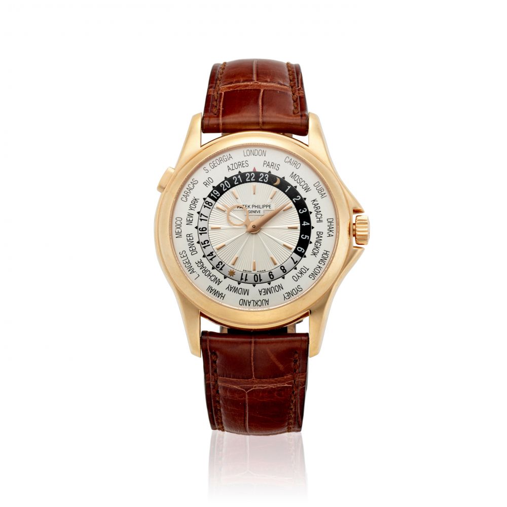 PATEK PHILIPPE. A FINE 18K ROSE GOLD AUTOMATIC WORLD TIME WATCH