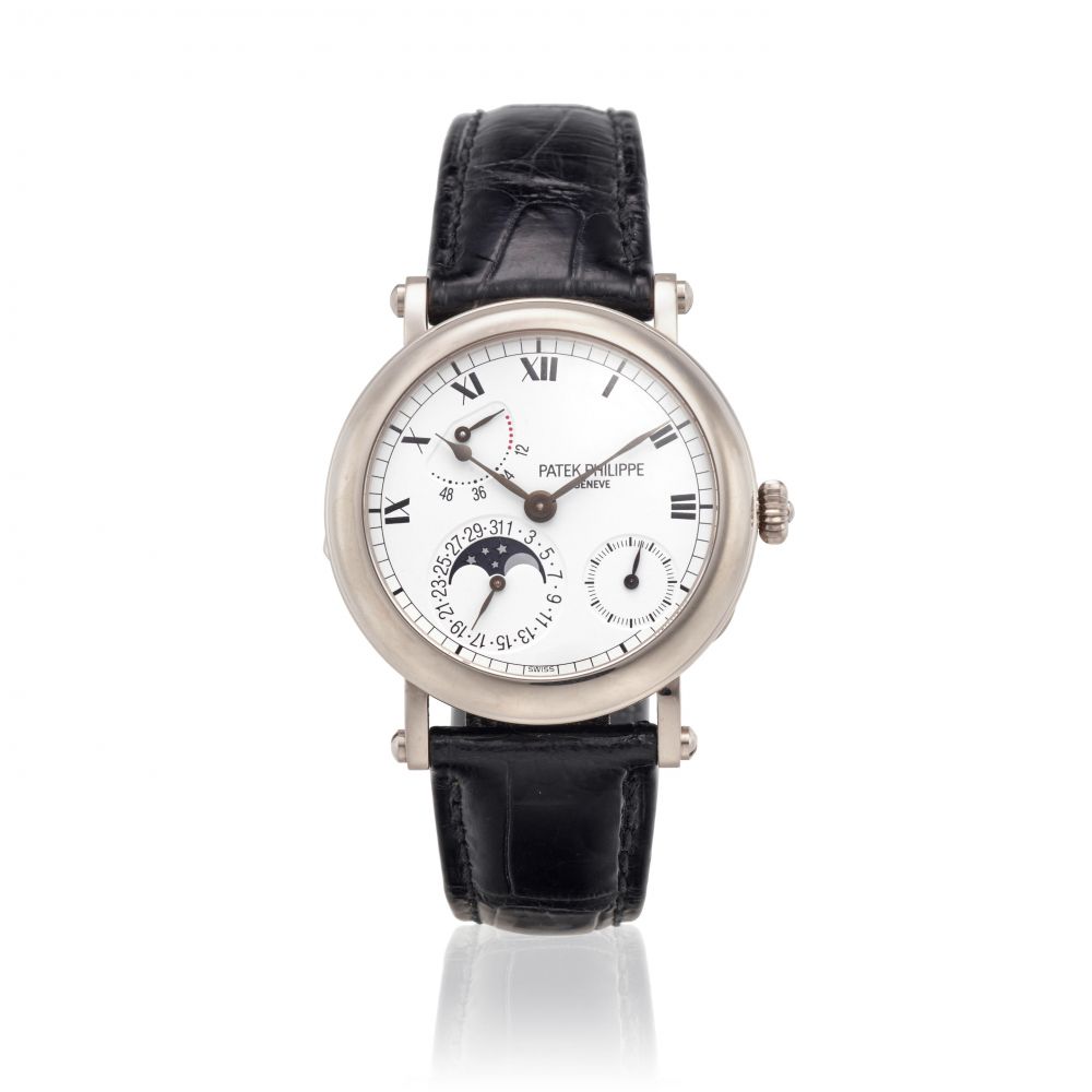 PATEK PHILIPPE. AN 18K WHITE GOLD AUTOMATIC CALENDAR WRISTWATCH WITH MOON PHASE AND POWER RESERVE