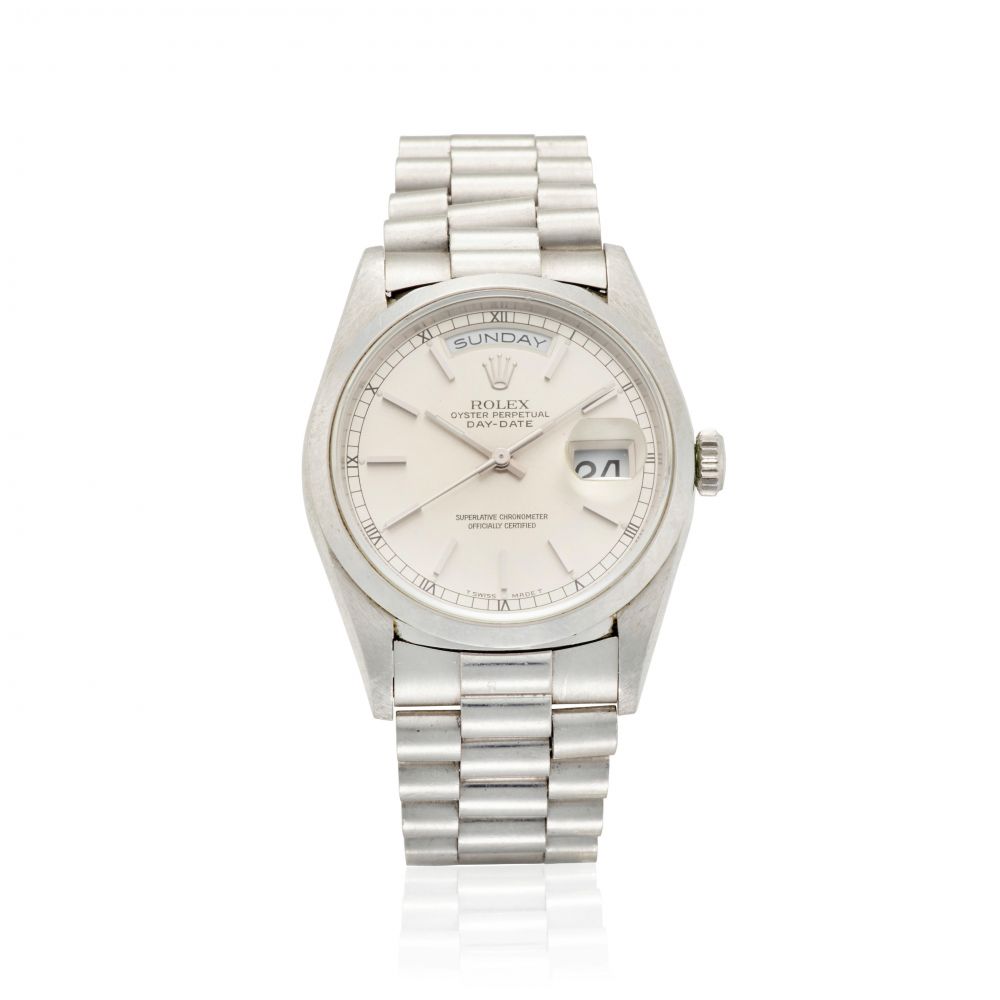 ROLEX. A HEAVY PLATINUM AUTOMATIC CALENDAR BRACELET WATCH