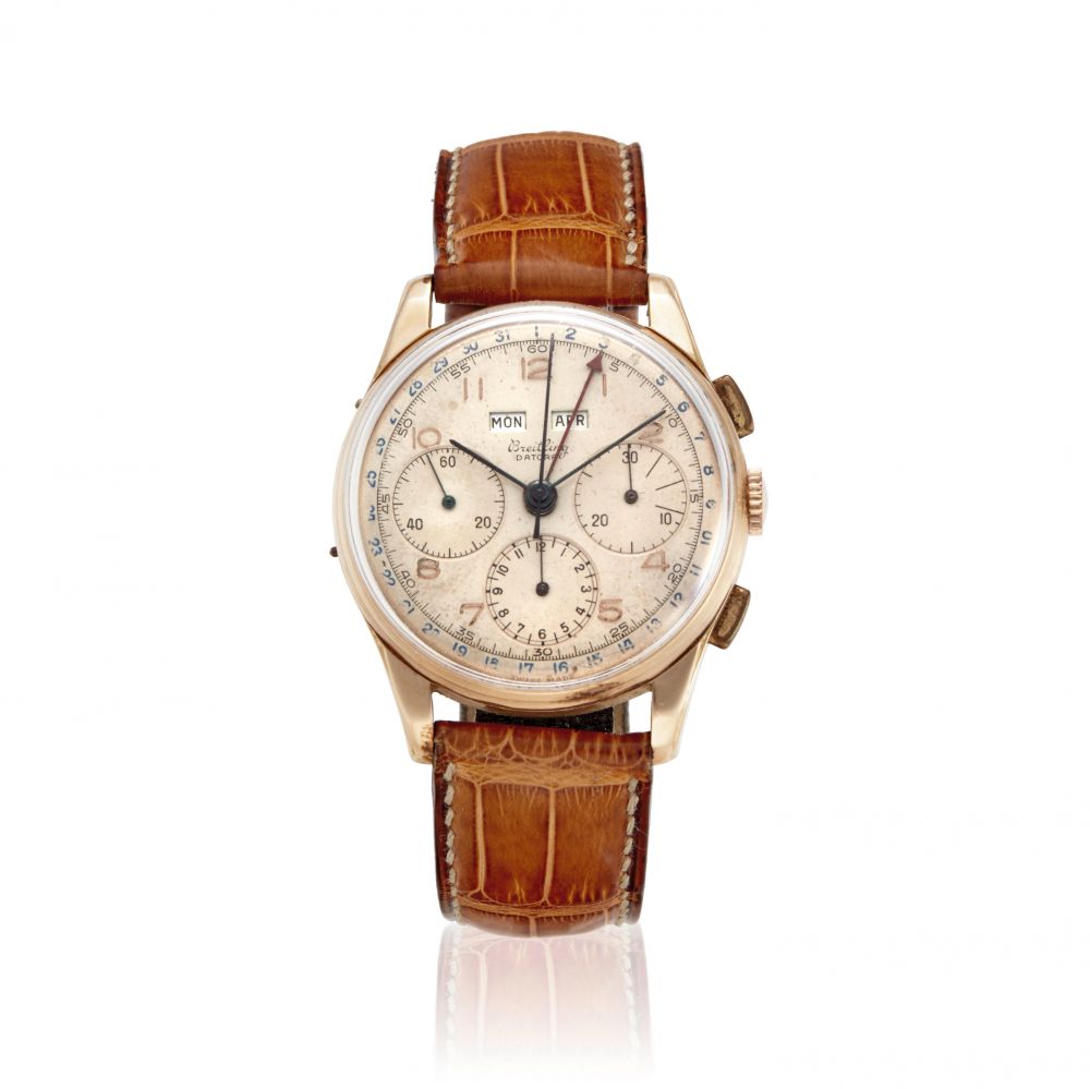 BREITLING. AN 18K GOLD MANUAL WIND TRIPLE CALENDAR CHRONOGRAPH WRISTWATCH