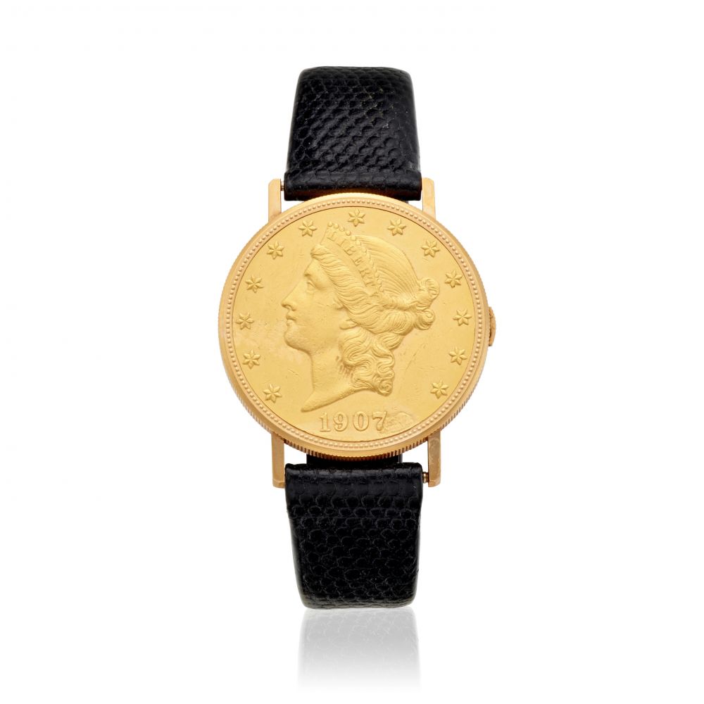 BUECHE-GIROD. AN 18K GOLD MANUAL WIND LIBERTY COIN WATCH