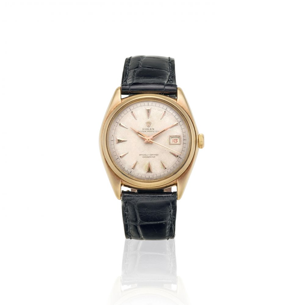 ROLEX. A 9K GOLD AUTOMATIC CALENDAR WRISTWATCH