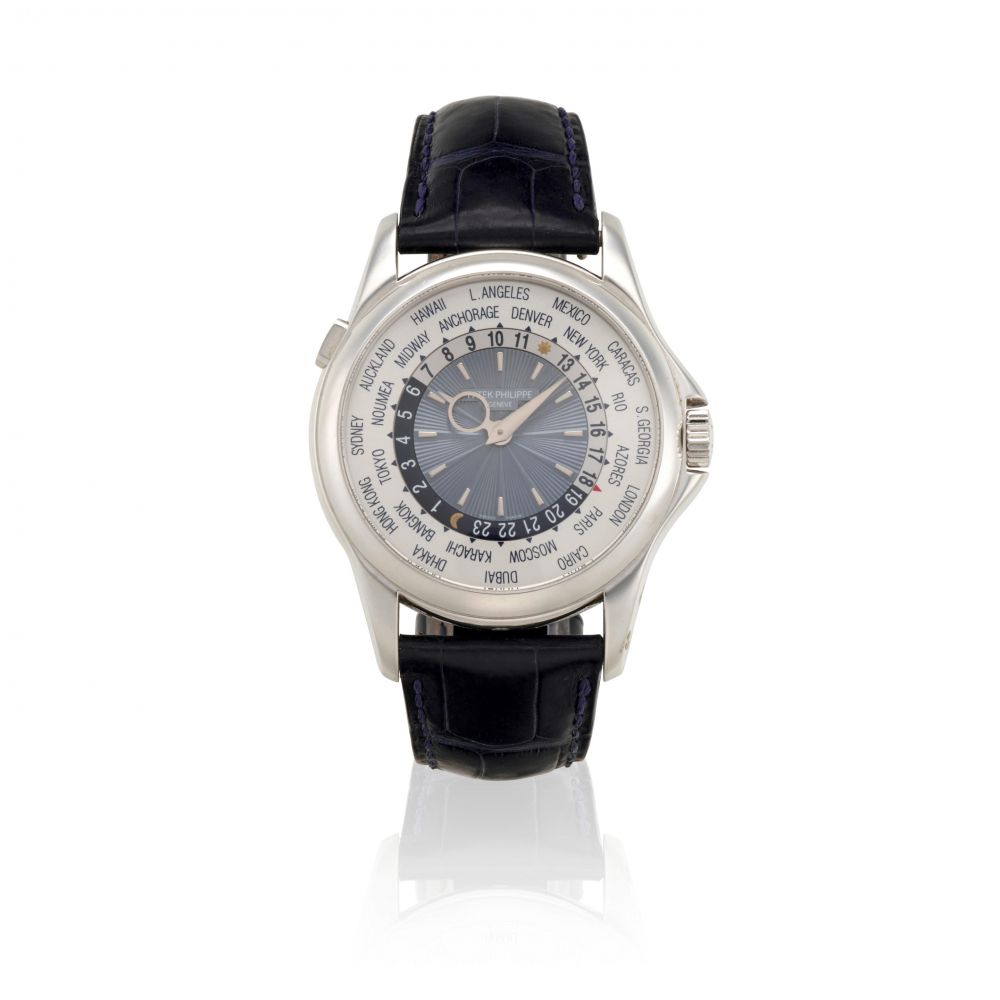 PATEK PHILIPPE. A FINE PLATINUM AUTOMATIC WORLD TIME WATCH