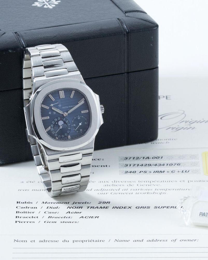 Patek Philippe | Nautilus Ref.3712/1A, A Fine and Rare Stainless Steel Bracelet Watch with Moonphase, Date and 4-Dot power reserve indicator, 2006