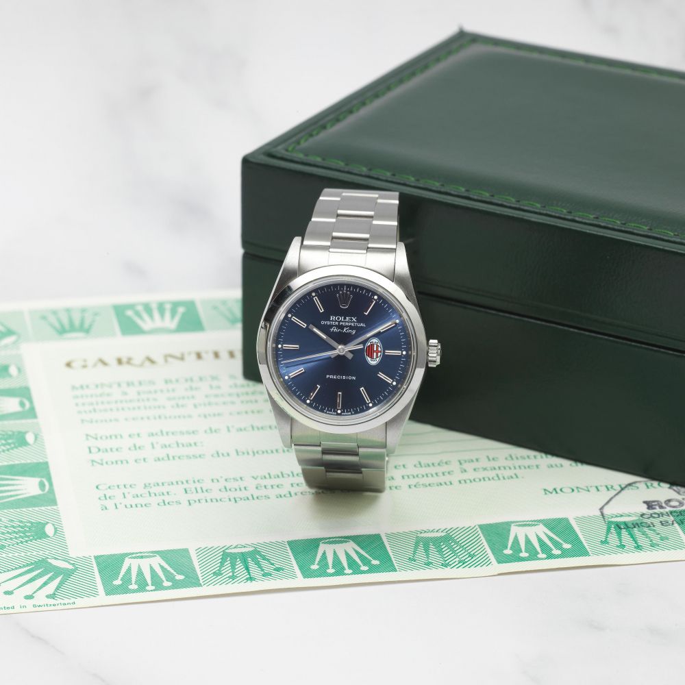 ROLEX. MONTRE BRACELET EN ACIER MOUVEMENT AUTOMATIQUE COMMEMORANT LES VICTOIRES DU MILAN AC EN CHAMPIONS LEAGUE ET SERIE A