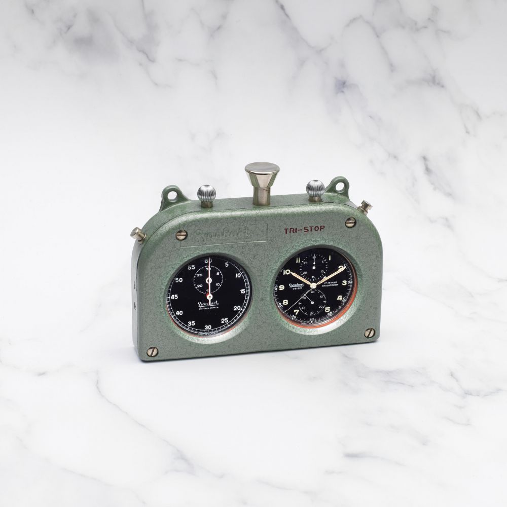 HANHART POUR FERRARI. RARE CHRONOGRAPHE STOP WATCH 'TRI-STOP' DE RALLYE EN ALUMINIUM COMPRENANT UN CHRONOGRAPHE A REMONTAGE MANUEL ET UN CHRONOGRAPHE RATRAPPANTE DANS UN ECRIN