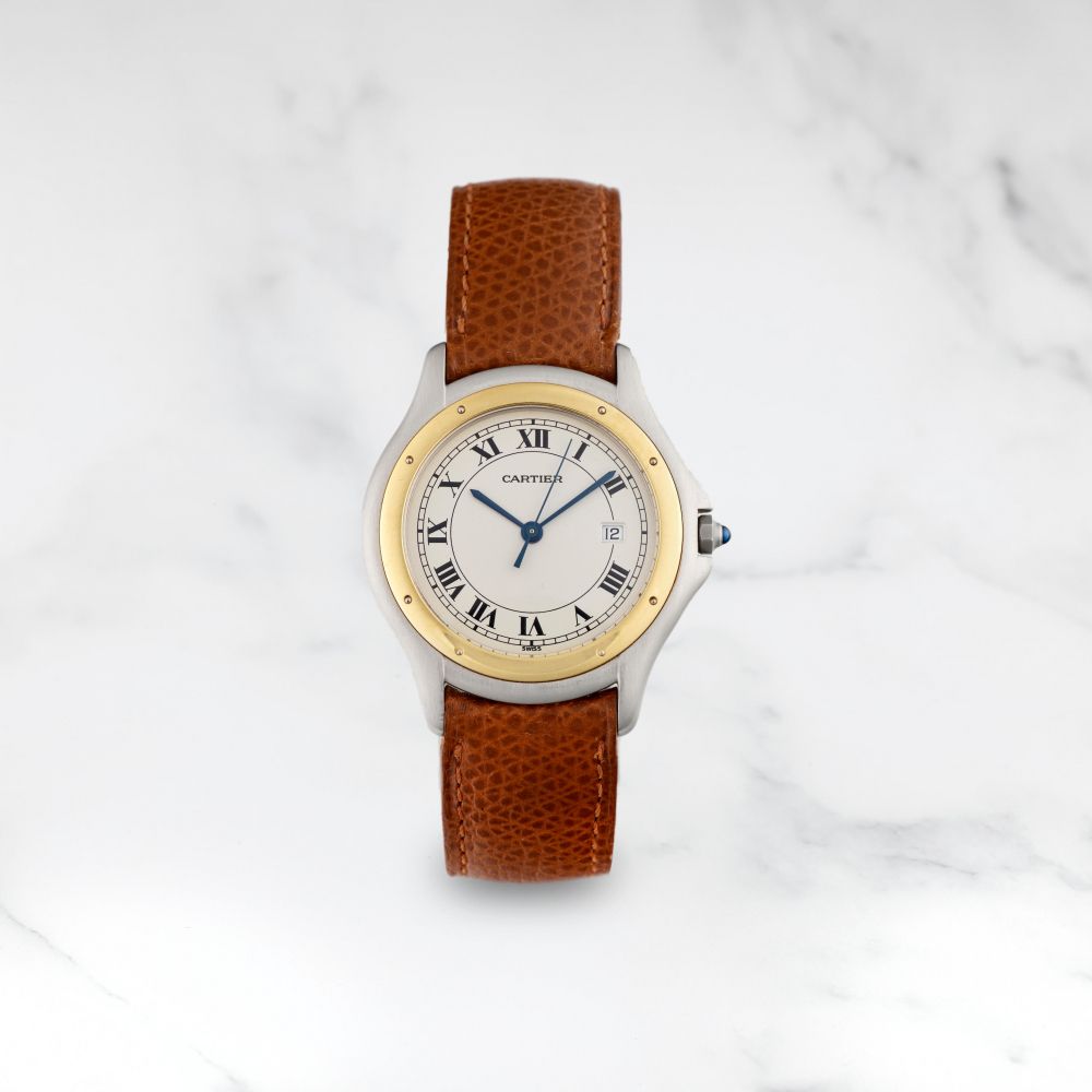 CARTIER. MONTRE BRACELET EN OR ET ACIER AVEC DATE MOUVEMENT QUARTZ