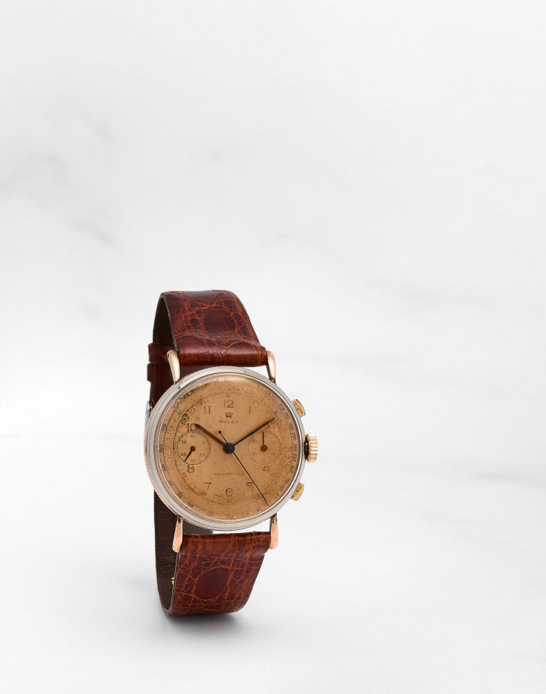 ROLEX. RARE CHRONOGRAPHE BRACELET EN METAL DORE ET ACIER MOUVEMENT MECANIQUE