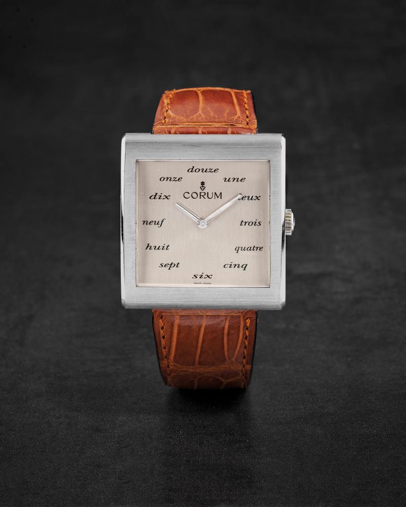 CORUM. RARE ET GRANDE MONTRE BRACELET EN ACIER DE FORME CARREE MOUVEMENT MECANIQUE