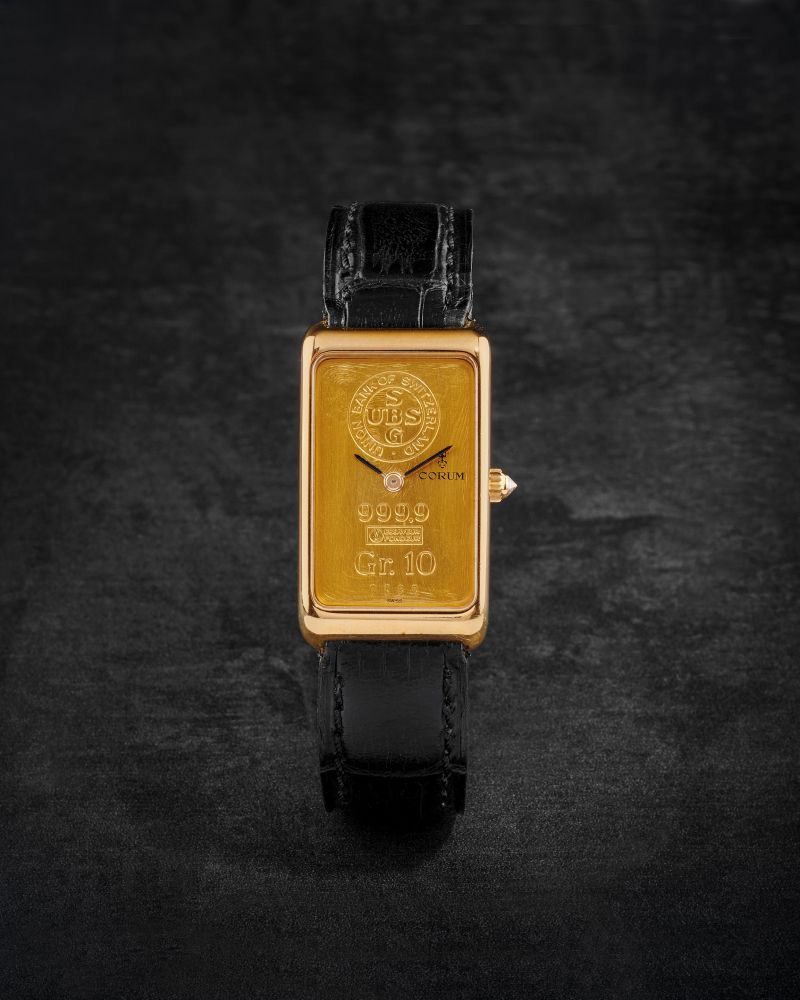 CORUM. MONTRE BRACELET EN OR JAUNE 18K (750) DE FORME RECTANGULAIRE AVEC CADRAN LINGOT MOUVEMENT MECANIQUE
