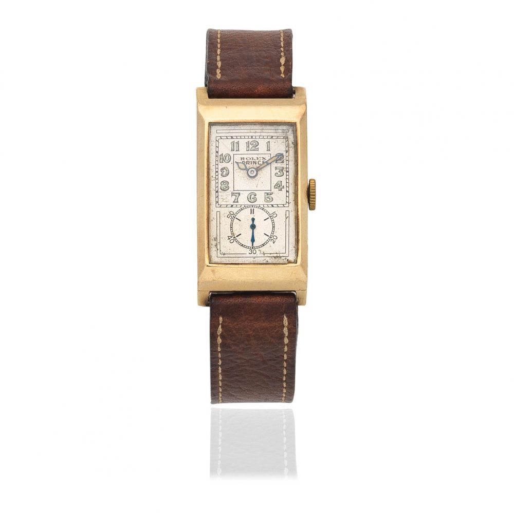 Rolex. A 9K gold manual wind rectangular wristwatch