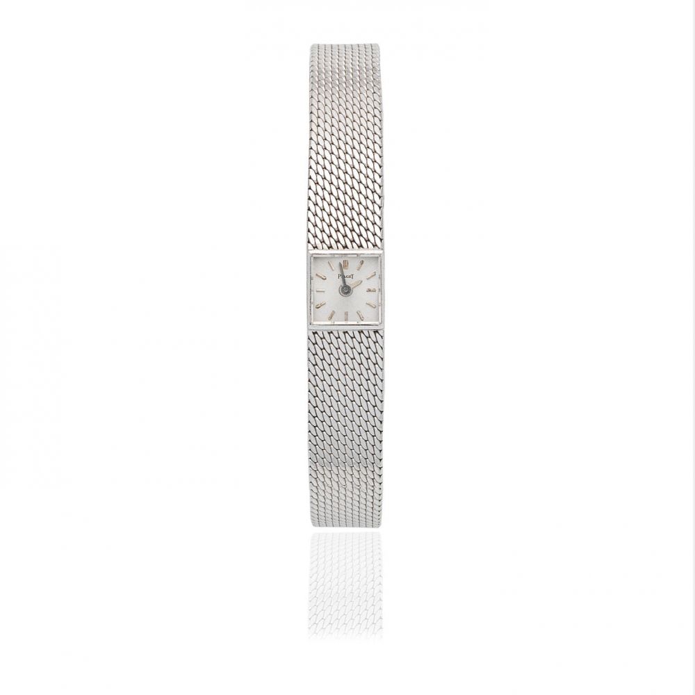Piaget. A lady's 18K white gold manual wind bracelet watch