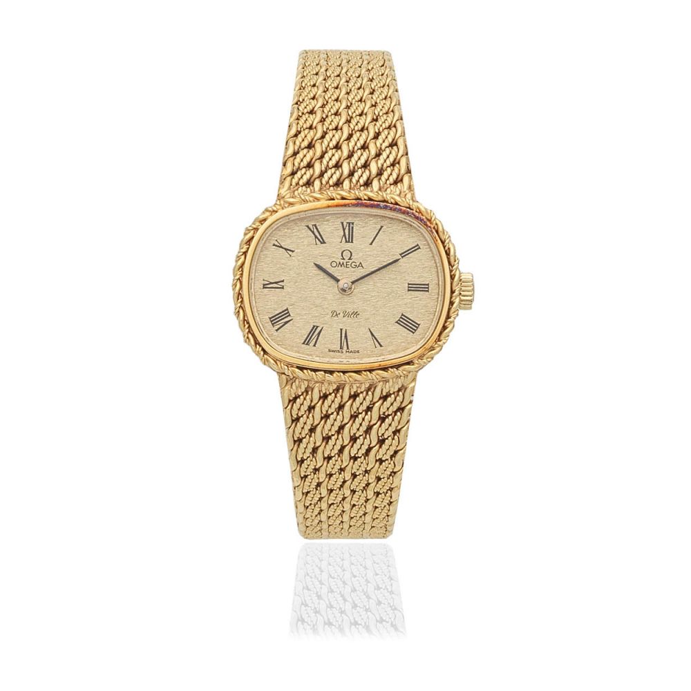 Omega. A lady's 18K gold manual wind bracelet watch