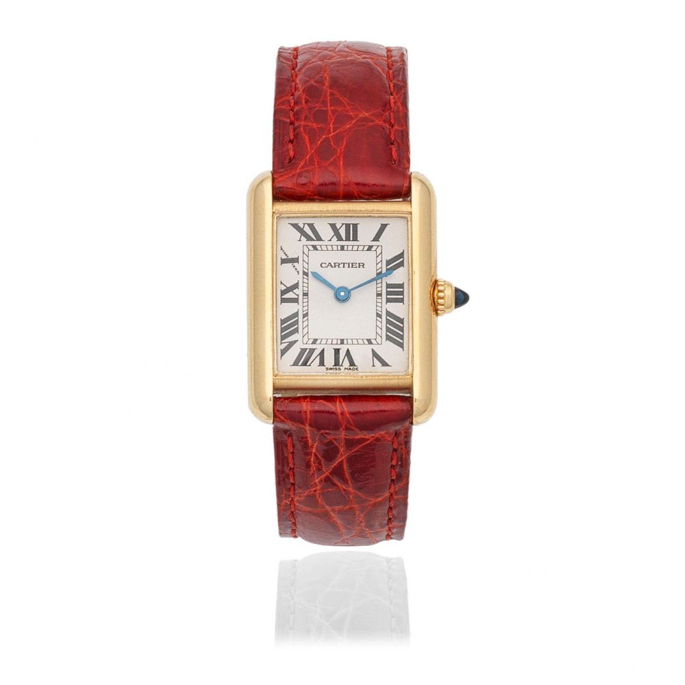 Cartier. A lady's 18K gold quartz wristwatch