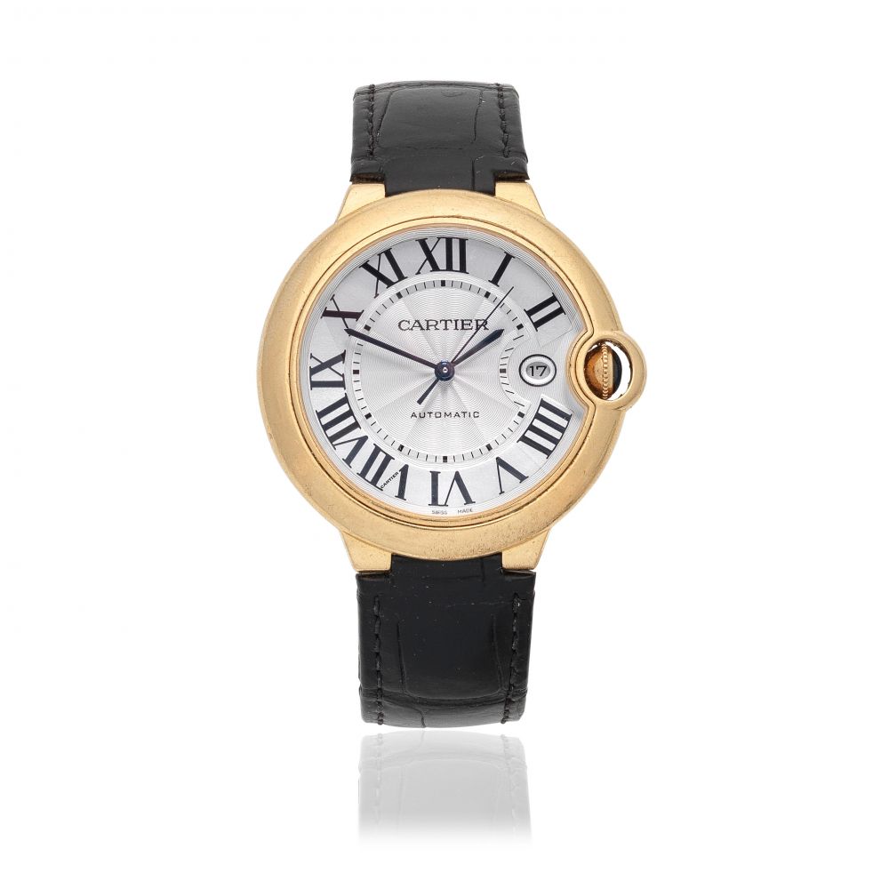 Cartier. An 18K gold automatic calendar wristwatch