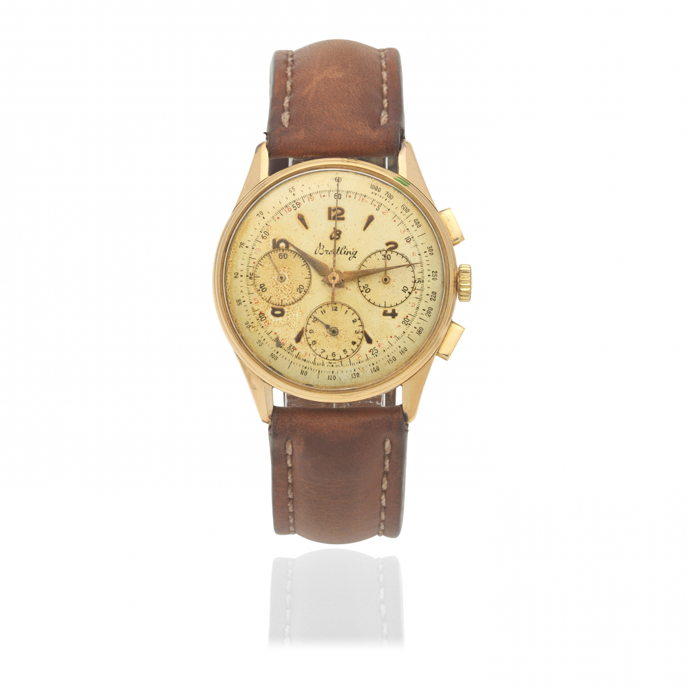 Breitling. An 18K gold manual wind chronograph wristwatch