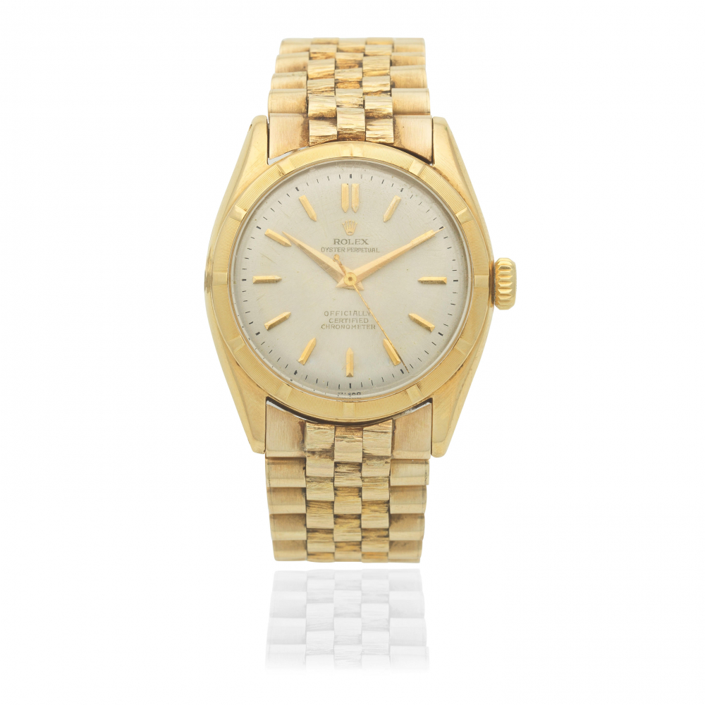 Rolex. An 18K gold automatic bracelet watch