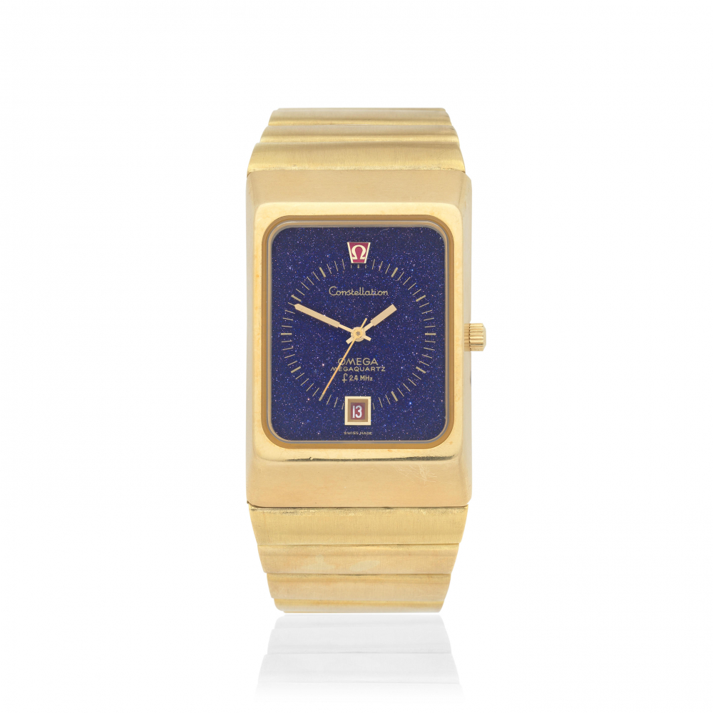 Omega. A heavy 18K gold quartz calendar bracelet watch