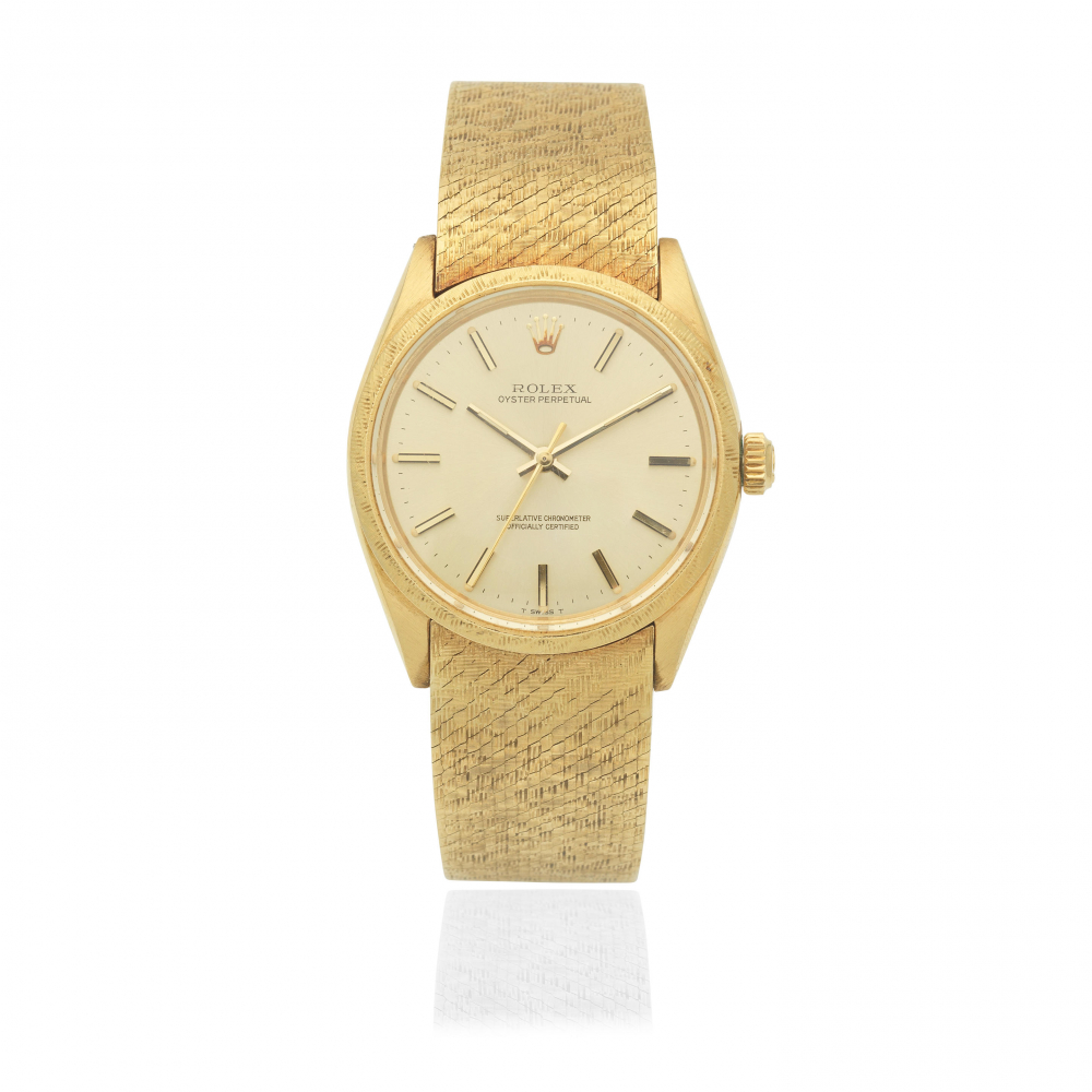 Rolex. An 18K gold automatic bracelet watch