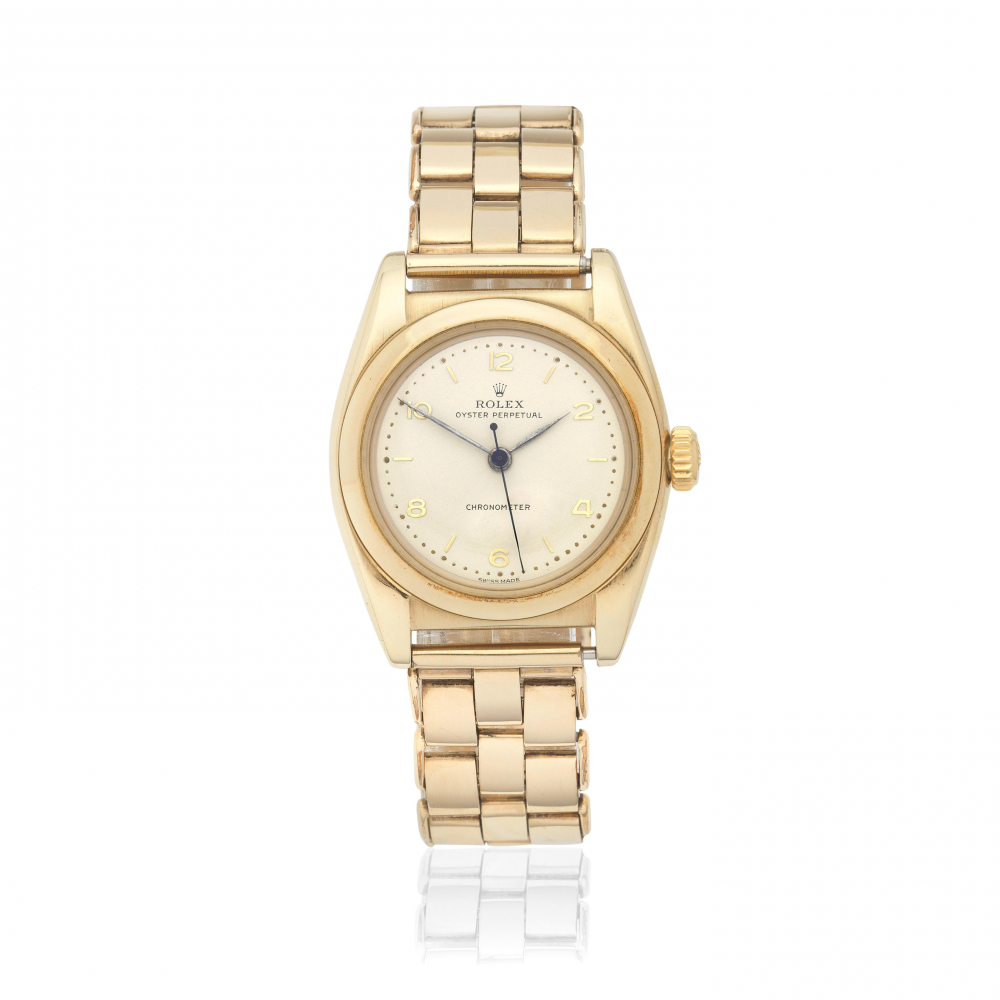 Rolex. A 9K gold automatic bubble back bracelet watch