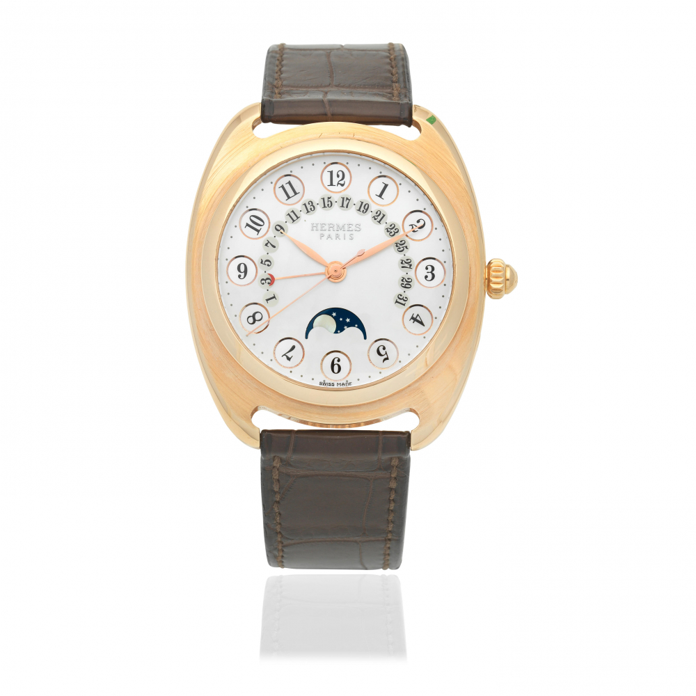 Hermes. A Limited Edition 18K rose gold automatic calendar wristwatch with moon phase and mother of pearl dial