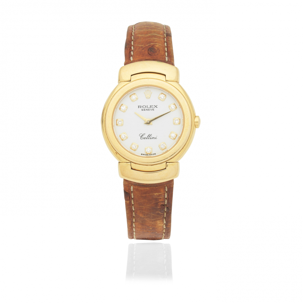 Rolex. A lady's 18K gold quartz wristwatch with diamond set dial
