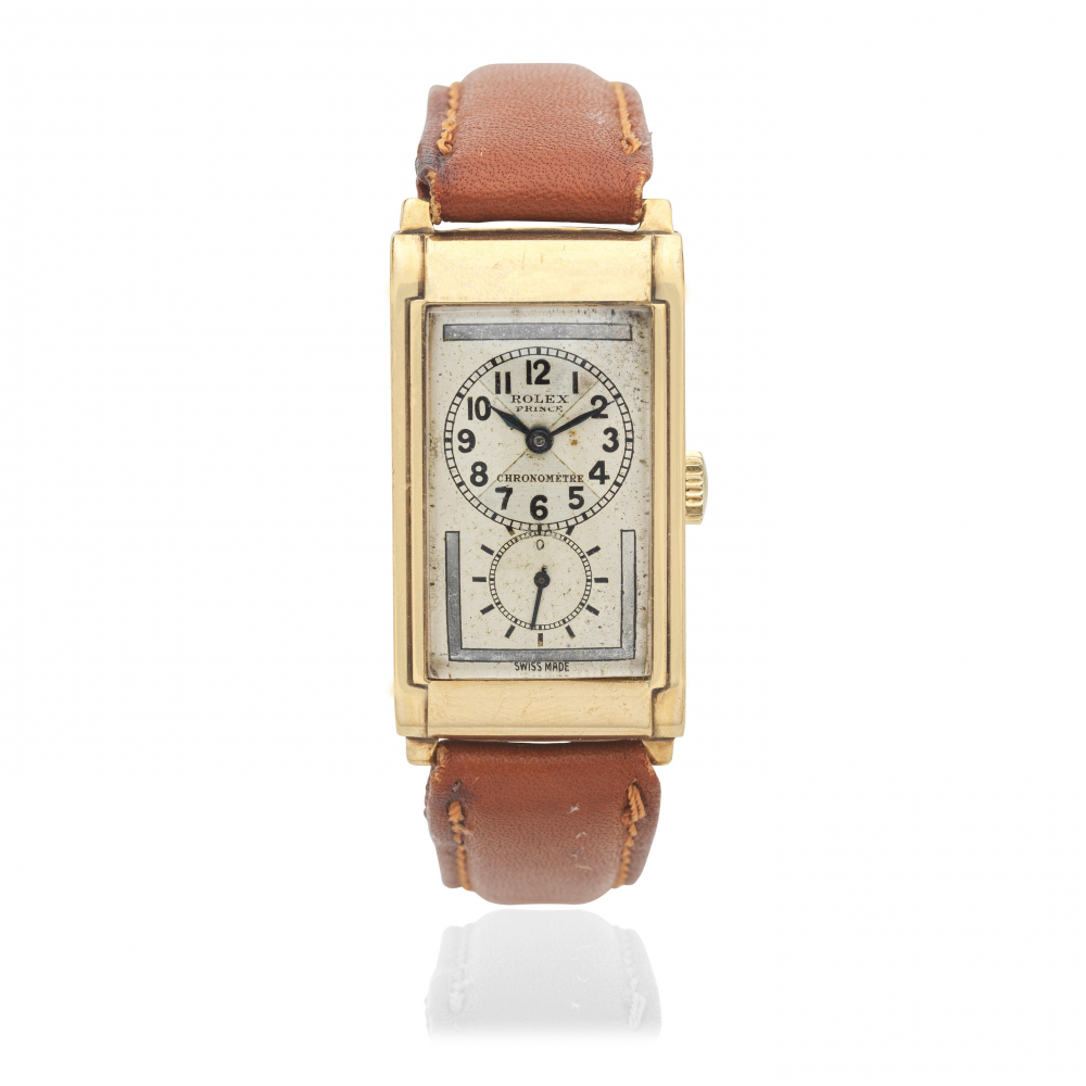Rolex. A 9K gold manual wind rectangular wristwatch