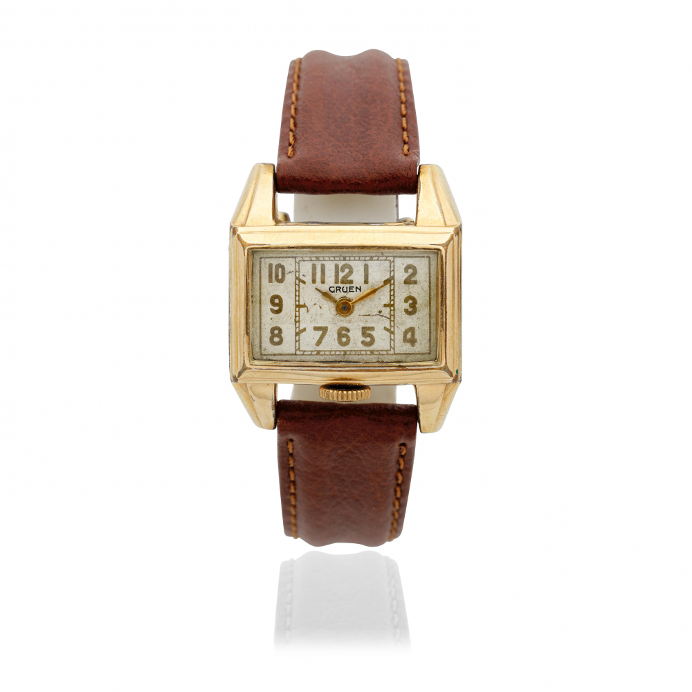 Gruen. A gold plated manual wind rectangular drivers wristwatch