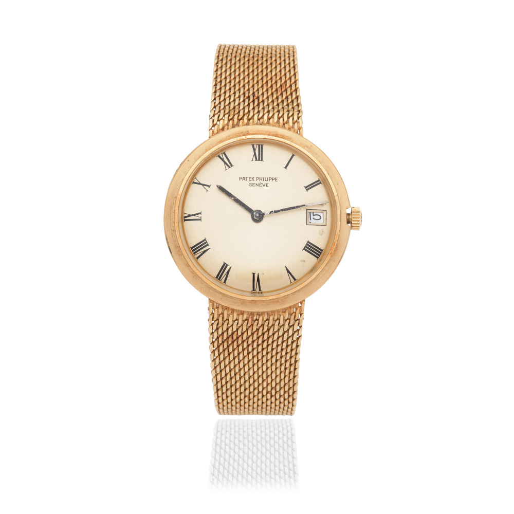 Patek Philippe. An 18K gold automatic calendar bracelet watch
