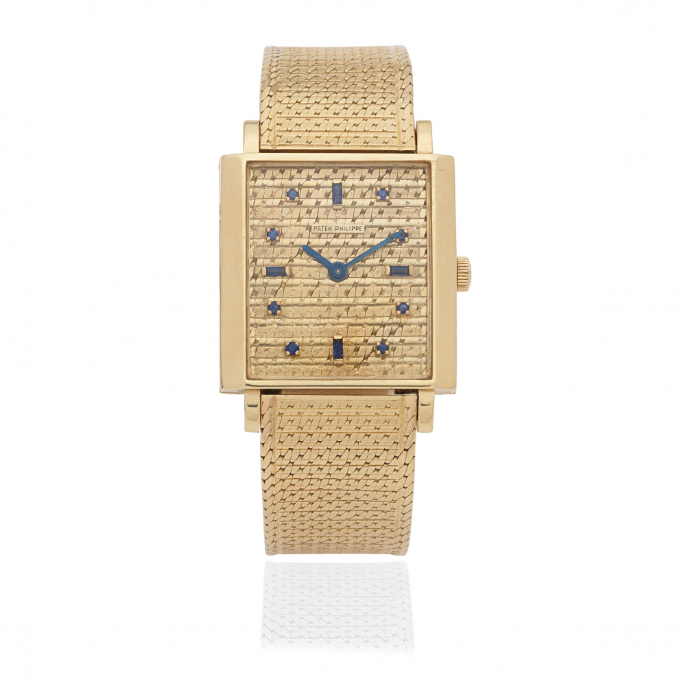 Patek Philippe. An 18K gold manual wind rectangular bracelet watch with sapphire set dial