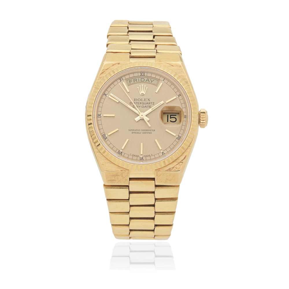 Rolex. An 18K gold quartz calendar bracelet watch