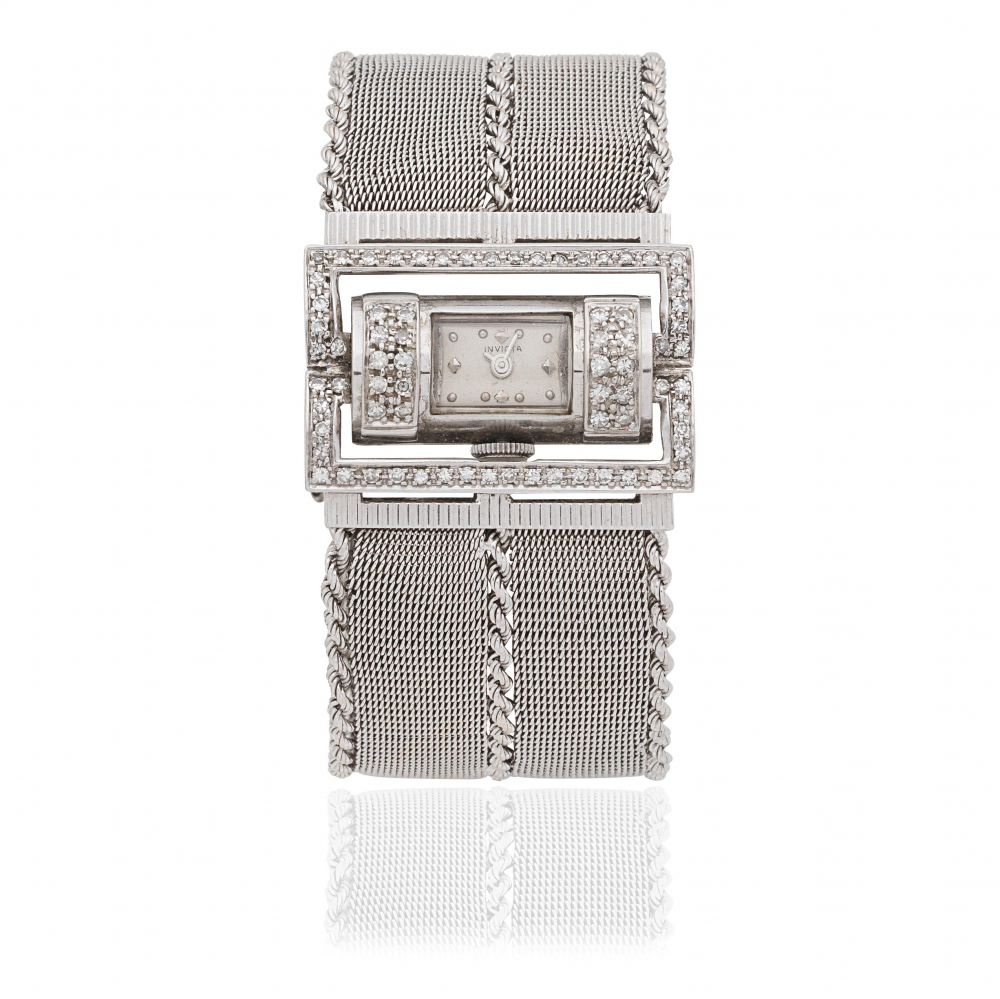 Invicta. An unusual lady's 18K white gold and diamond set manual wind bracelet watch